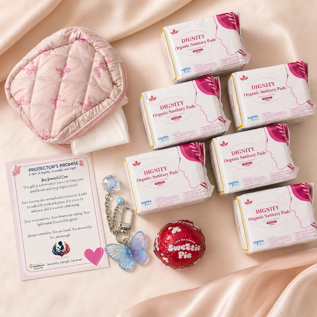 SHINE Pack contents flat lay showing organic pads, pouch, card, keyring, and comfort treat
