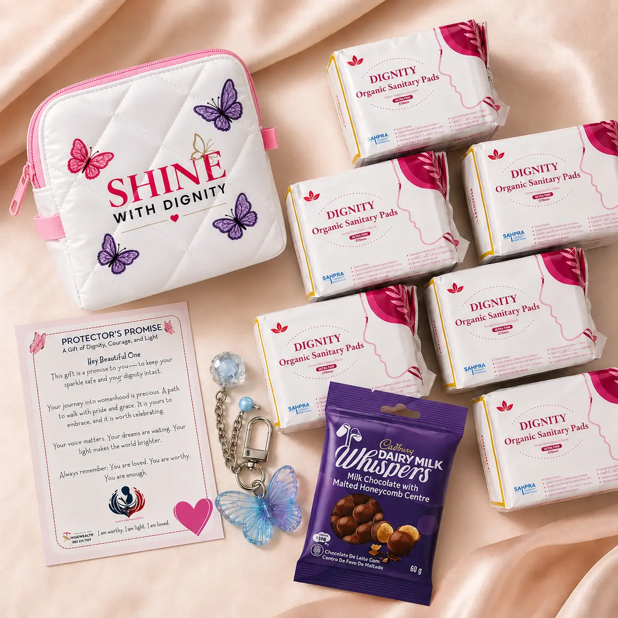 Complete SHINE Pack contents laid out — pads, pouch, card, keyring, and sweet gift